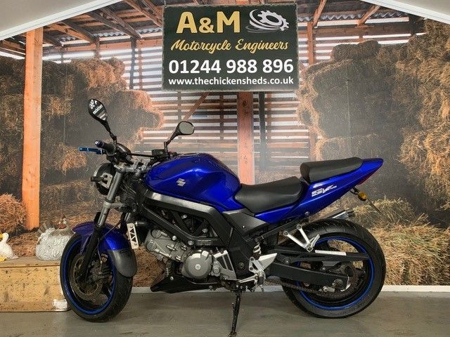 blue motorcycle full body side view